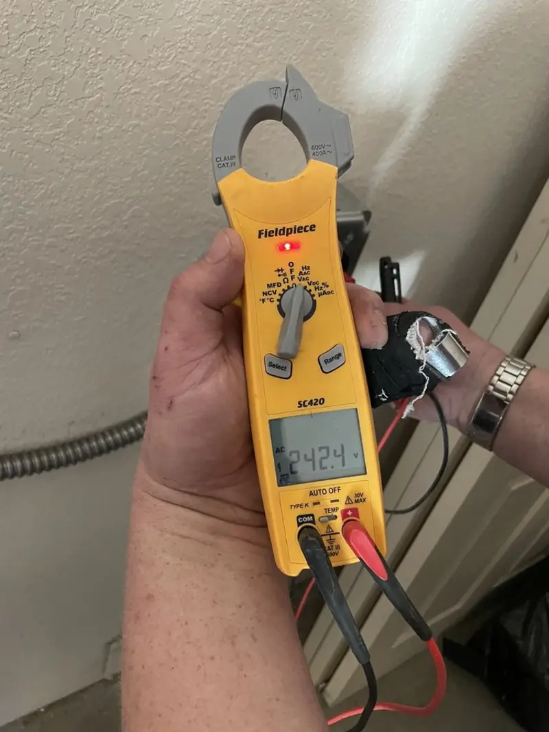 Voltage testing with clamp meter during Electrical Installation Services in Imlay City